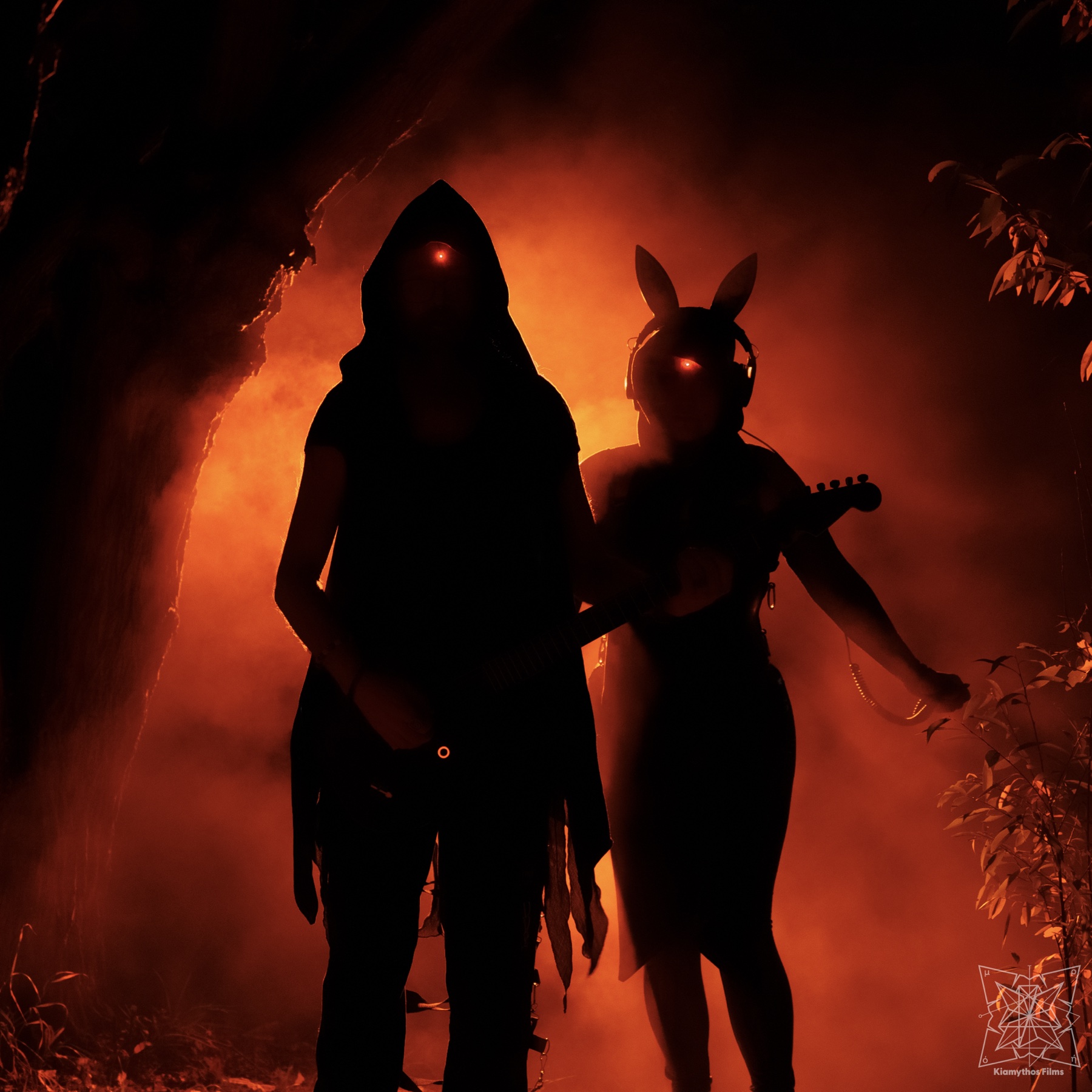 Silhouetted artist portrait in red haze.