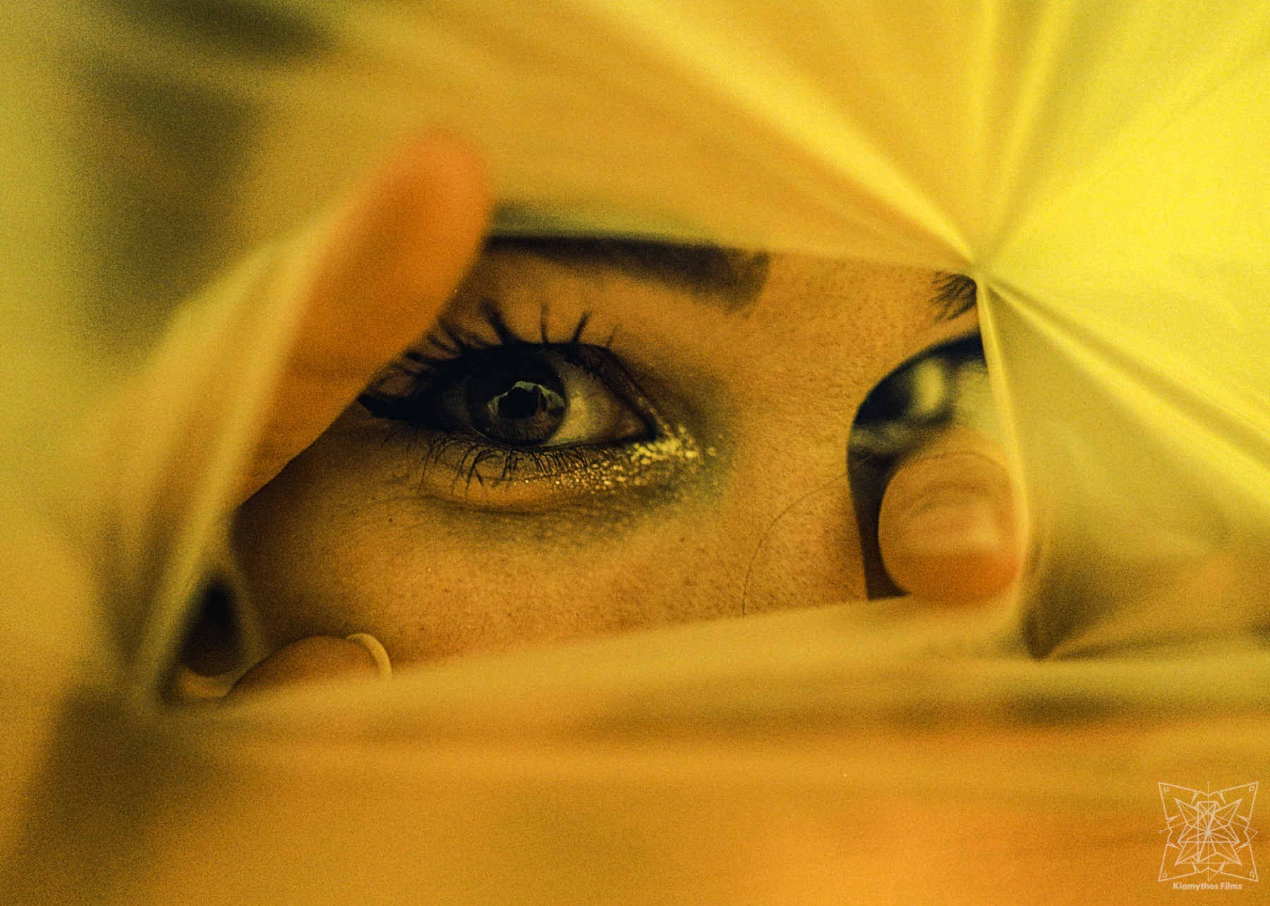 Two silhouetted performers in red haze.