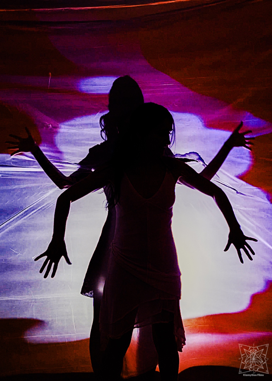 Close performance image of an eye framed by yellow fabric.